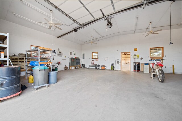 garage featuring ceiling fan and a garage door opener