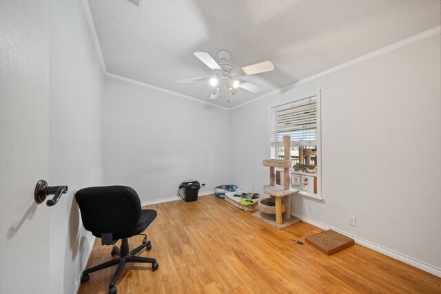 office space featuring hardwood / wood-style floors, ceiling fan, and crown molding