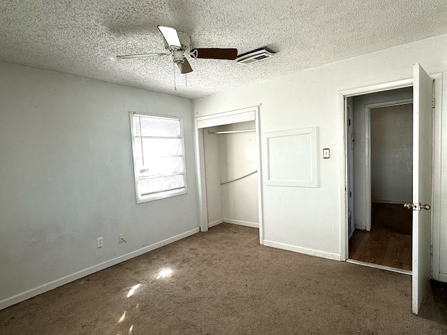 unfurnished bedroom featuring ceiling fan, a closet, and a textured ceiling