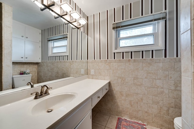 bathroom featuring tile walls, tile patterned flooring, vanity, and toilet
