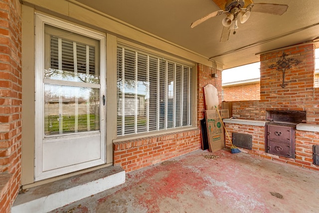 view of patio featuring a ceiling fan