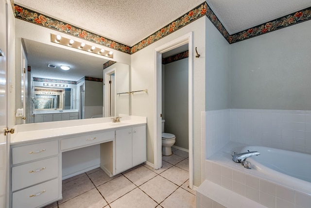 bathroom with toilet, a textured ceiling, a garden tub, and vanity