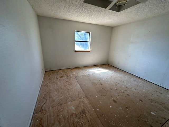 interior space featuring a textured ceiling