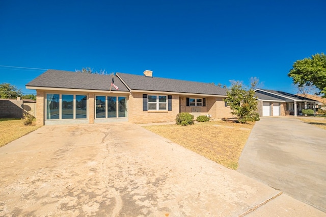 ranch-style home featuring a garage