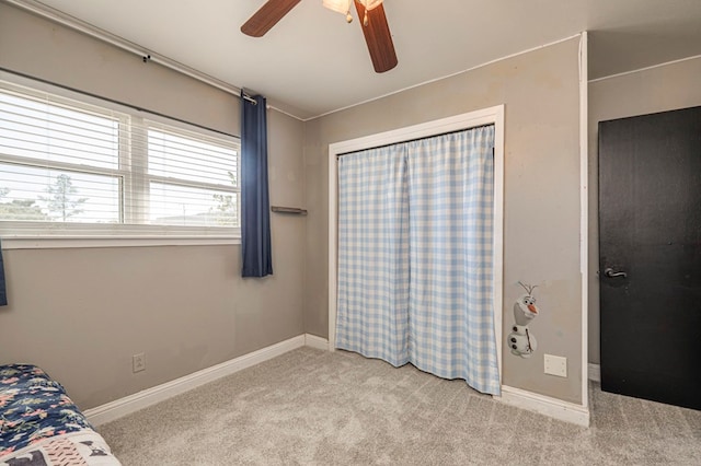 bedroom with ceiling fan and light colored carpet