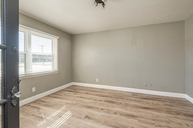 empty room with hardwood / wood-style floors