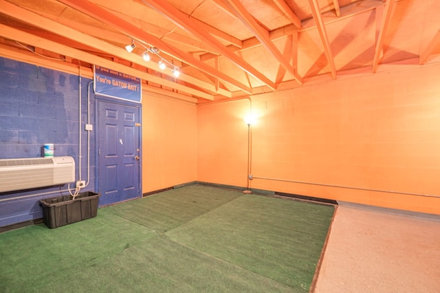 basement featuring a wall unit AC