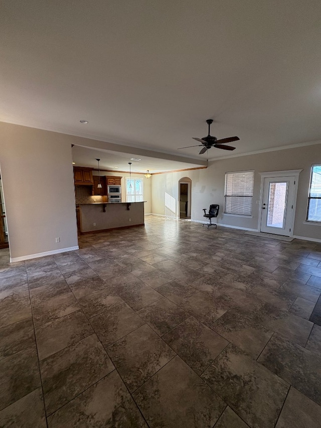 unfurnished living room featuring ceiling fan