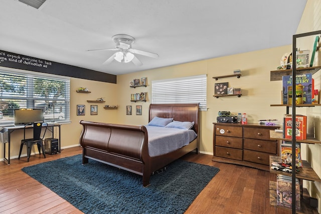 bedroom with hardwood / wood-style flooring