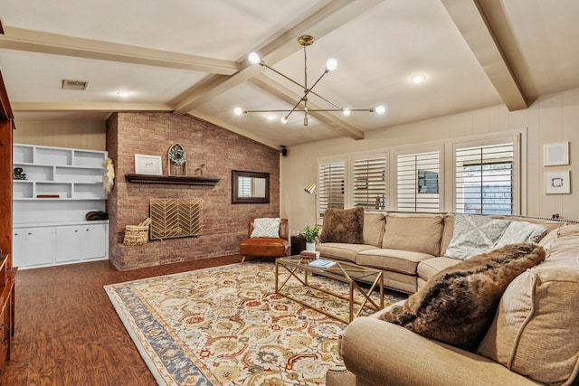 living room with dark wood-type flooring, vaulted ceiling with beams, a fireplace, brick wall, and a chandelier