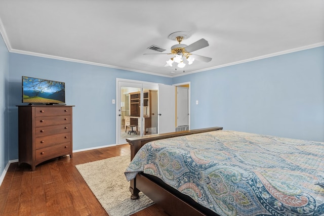 bedroom with ornamental molding, dark wood-type flooring, and ceiling fan