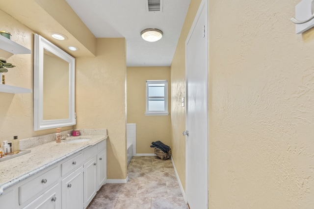 bathroom featuring vanity and a bathing tub