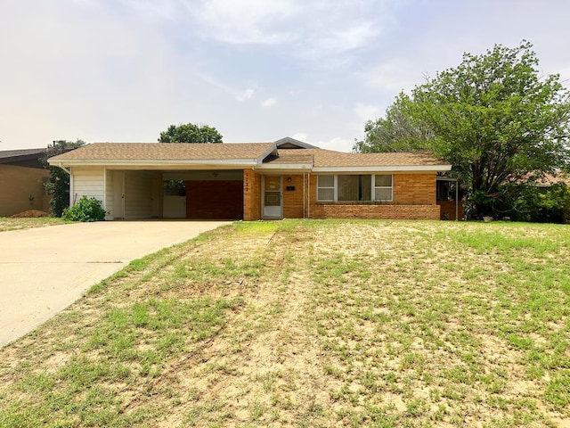 1722 Yale Ave, Big Spring, TX 79720 - single story home featuring concrete driveway, a front yard, and an attached carport