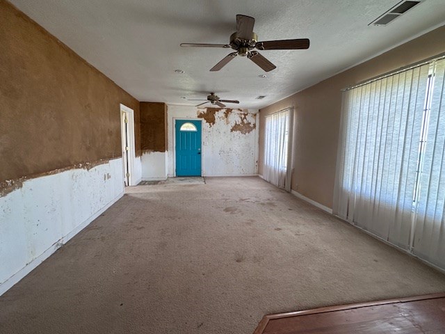 999 S County Rd 183, Snyder, TX 79549 - carpeted spare room featuring ceiling fan