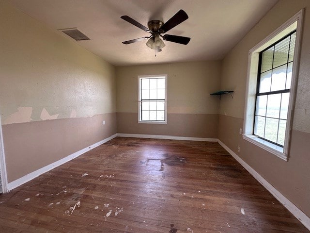 999 S County Rd 183, Snyder, TX 79549 - spare room featuring hardwood / wood-style flooring, ceiling fan, and baseboards