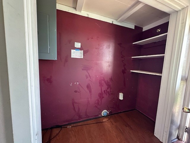 999 S County Rd 183, Snyder, TX 79549 - laundry area with electric panel and wood finished floors