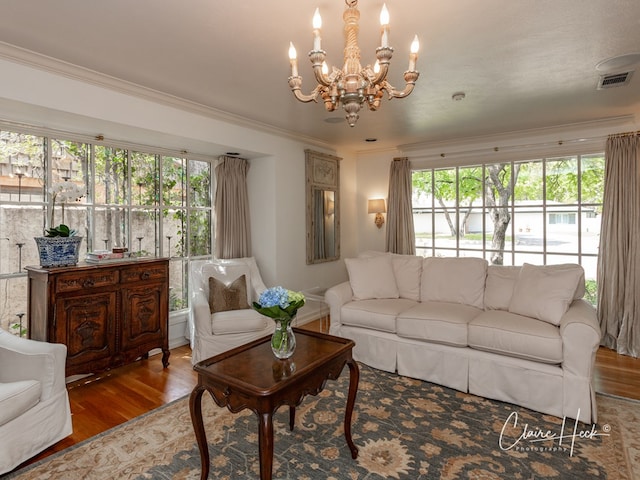 1509 Bedford Dr, Midland, TX 79701 - living area with a chandelier, wood finished floors, and crown molding
