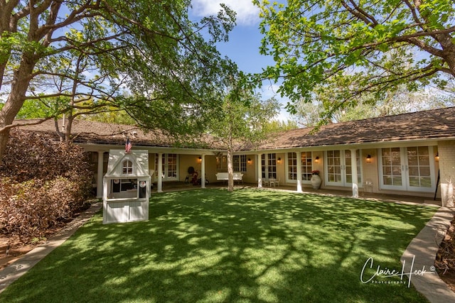 1509 Bedford Dr, Midland, TX 79701 - rear view of property with french doors and a lawn