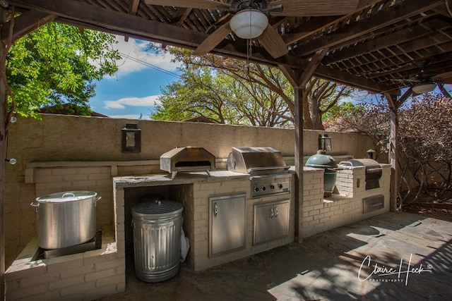 1509 Bedford Dr, Midland, TX 79701 - view of patio featuring a grill, a ceiling fan, exterior kitchen, and a gazebo