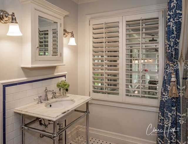 1509 Bedford Dr, Midland, TX 79701 - bathroom featuring a sink and ornamental molding
