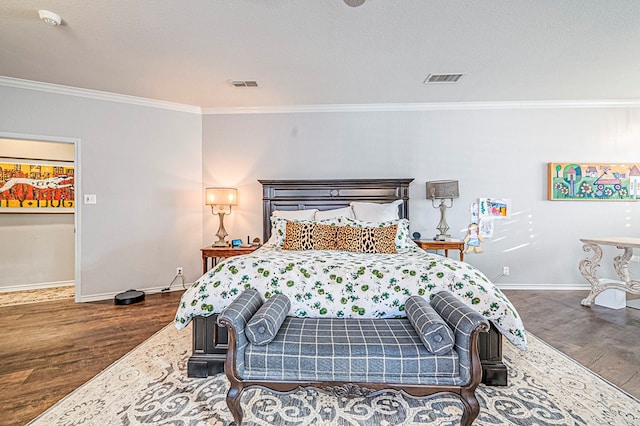 bedroom with dark wood-type flooring and ornamental molding