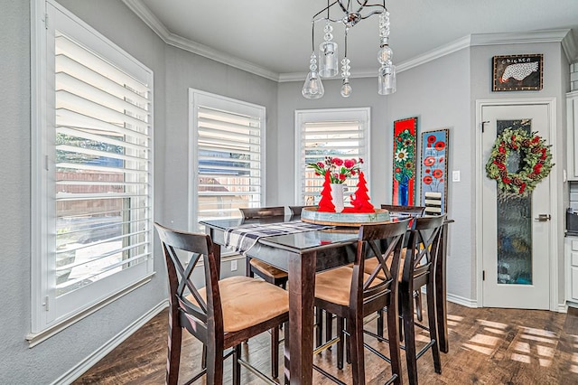 dining room with dark hardwood / wood-style floors and ornamental molding