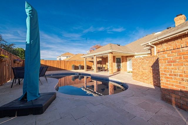 view of swimming pool featuring a patio