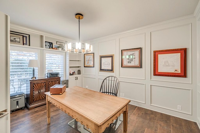 dining space with a chandelier, dark hardwood / wood-style floors, and crown molding