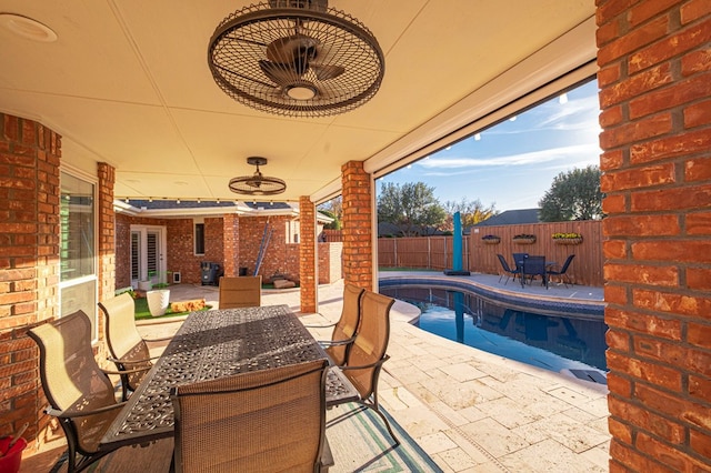 view of patio featuring a fenced in pool