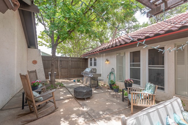 1115 Gulf Ave, Midland, TX 79705 - view of patio featuring a grill, fence, and a pergola