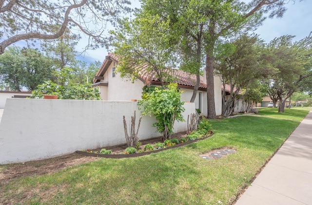 1115 Gulf Ave, Midland, TX 79705 - view of side of home featuring a tile roof and stucco siding