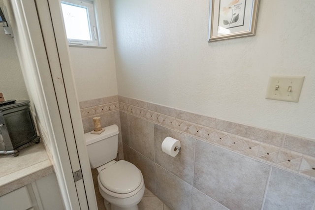 1115 Gulf Ave, Midland, TX 79705 - bathroom with toilet and wainscoting