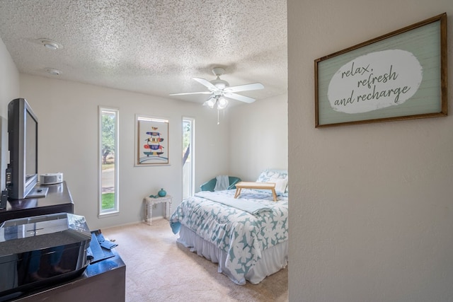 1115 Gulf Ave, Midland, TX 79705 - bedroom featuring a textured ceiling, carpet floors, and ceiling fan