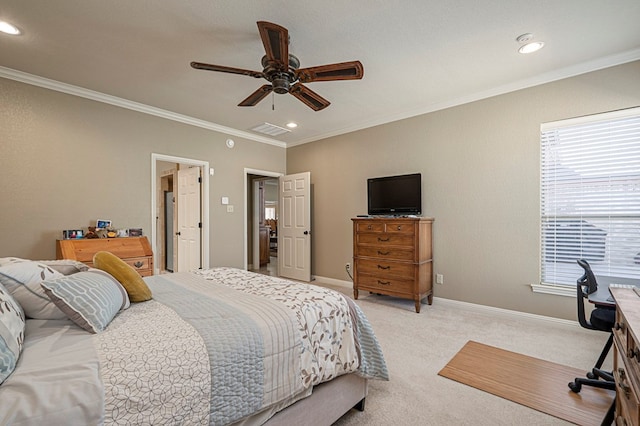 bedroom with ornamental molding, light carpet, and baseboards