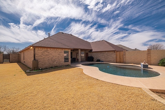 view of pool with a fenced in pool, a patio area, a fenced backyard, and a lawn