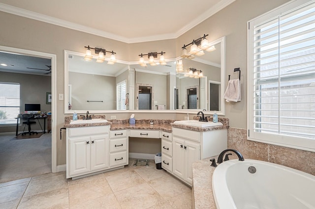 bathroom with ornamental molding, tile patterned flooring, a garden tub, and vanity