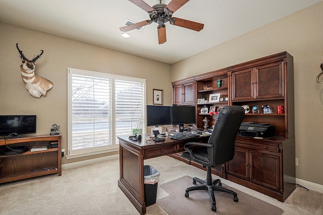 office area with ceiling fan, baseboards, and light colored carpet