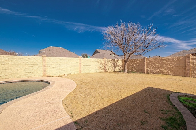 view of yard featuring a fenced backyard and a fenced in pool