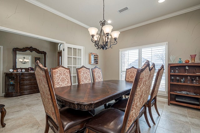 dining room with a notable chandelier, visible vents, and crown molding