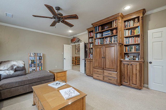 living area featuring light carpet, visible vents, a ceiling fan, a textured ceiling, and crown molding