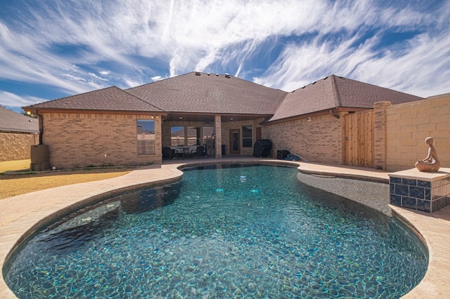 view of pool featuring a patio area, fence, and a fenced in pool