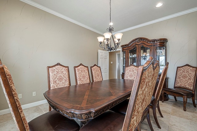 dining area with a chandelier, crown molding, and baseboards