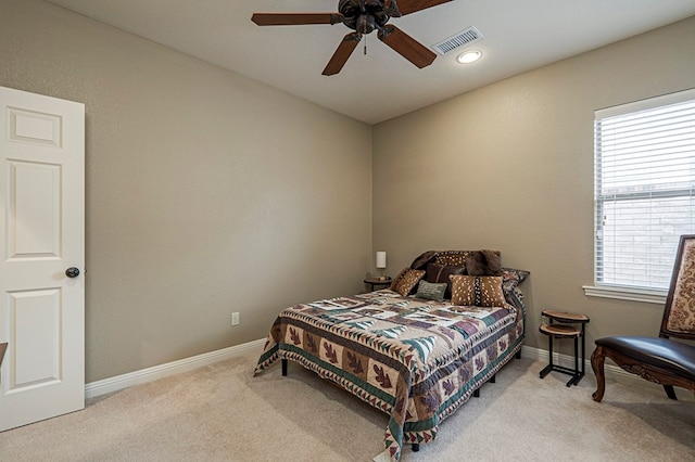 bedroom with carpet, visible vents, ceiling fan, and baseboards