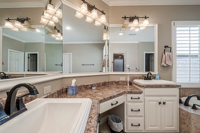 full bath with crown molding, a sink, and a healthy amount of sunlight