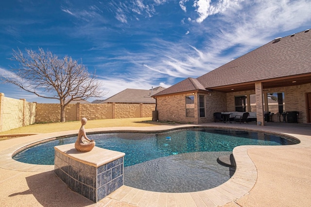 view of swimming pool featuring a fenced in pool, a fenced backyard, and a patio