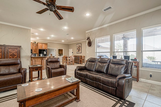 living room with recessed lighting, visible vents, and crown molding