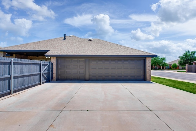 garage featuring fence