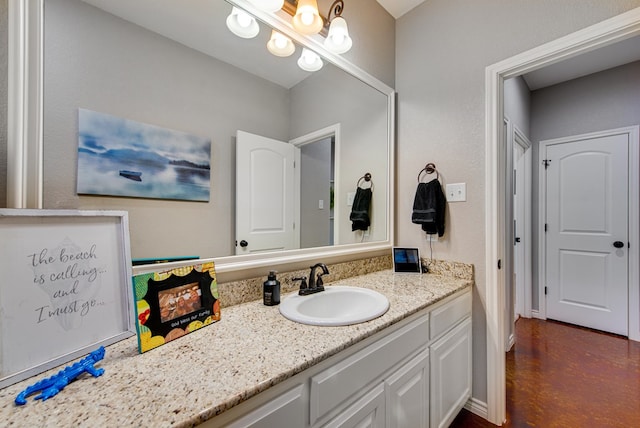 bathroom with vanity and concrete flooring