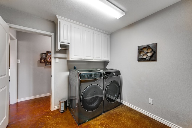 laundry room featuring cabinet space, independent washer and dryer, and baseboards