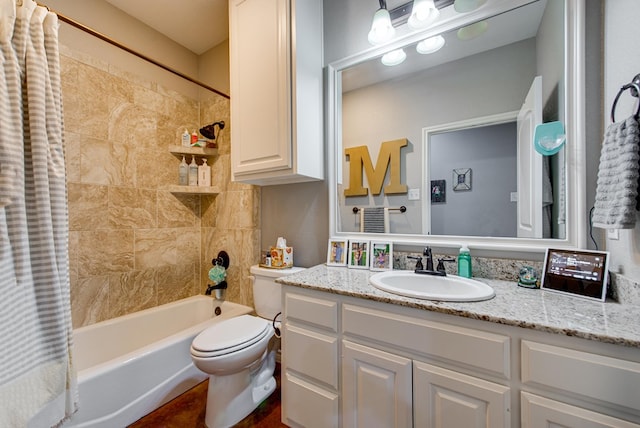 full bathroom with shower / tub combo, vanity, and toilet